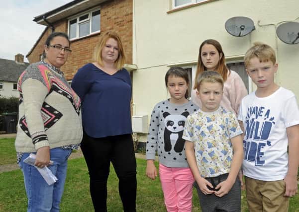 Navy wives, Tracy Stinton (left) and Lucy Stegar and their children (left to right), Rhiannan Stinton (eight), Jasmine Stinton (12), Alfie Stegar (seven), and Harvey Stegar (nine), outside Tracy's MoD house in Gosport which she says is unfit to live in.
Picture Ian Hargreaves (161254-2)