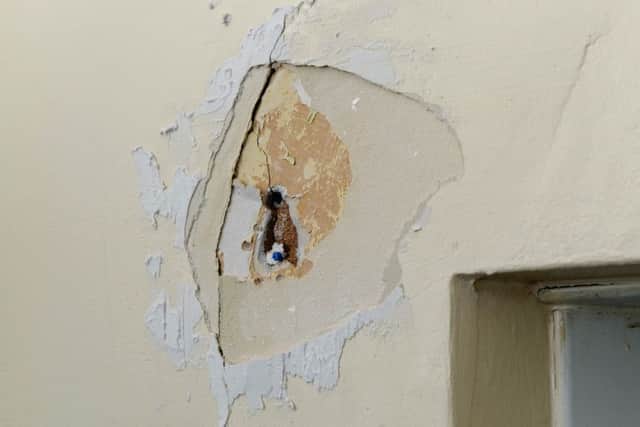 A huge hole in one of the military homes
