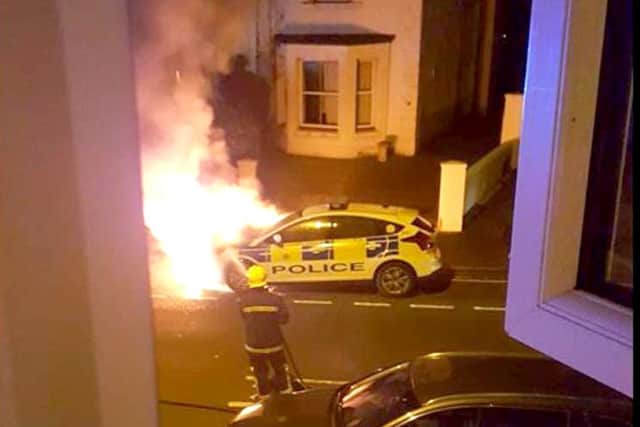 A picture taken by  Terri Wilson of the police car on fire in Foster Road, Gosport