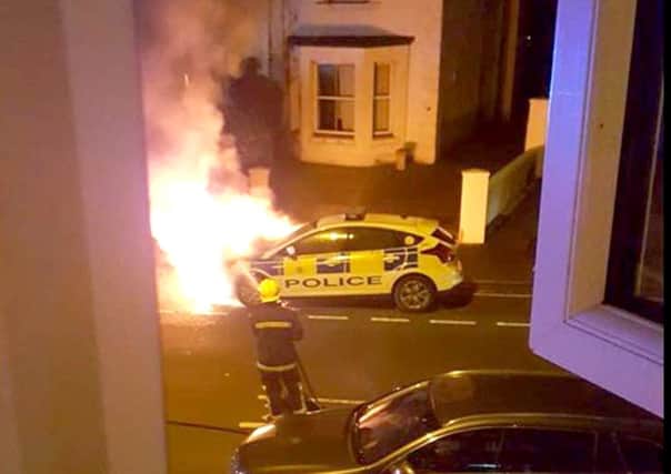 A picture taken by  Terri Wilson of the police car on fire in Foster Road, Gosport