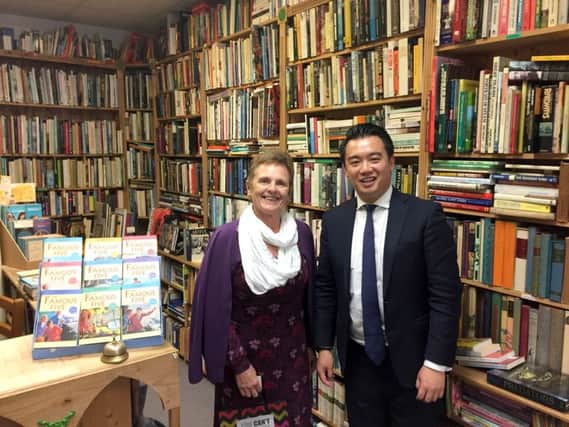CHALLENGE Carol Waldron, the owner of Bookends, Emsworth, with Alan Mak