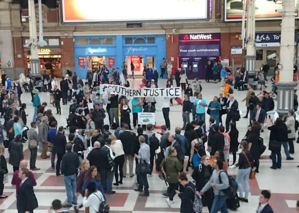 The protest by Southern Rail commuters at London Victoria station.