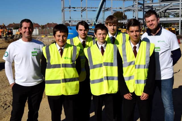 Trafalgar students with BAM contractors Brett Younger, left, and Matt Crookes, rightPicture: Tom Cotterill