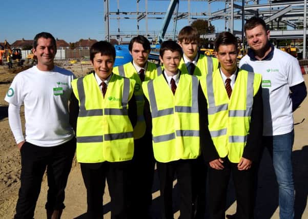 Trafalgar students with BAM contractors Brett Younger, left, and Matt Crookes, right

Picture: Tom Cotterill