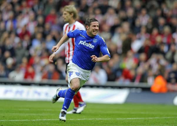 David Norris celebrates his equaliser in the derby draw with Southampton in 2012