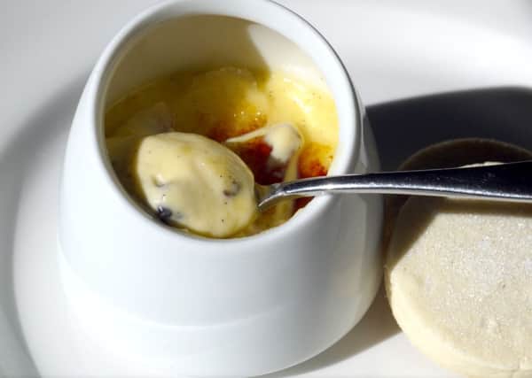 Creme brulee with blackberries and blueberries