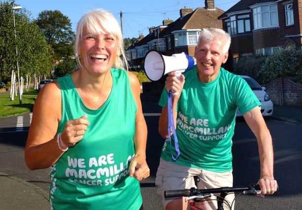 Brian Ward, who was diagnosed with oesophageal cancer last year, cycles behind his daughter Sharon Lobban in order to help her prepare for the Great South Run this weekend. Sharon will run for Macmillan Cancer Support.