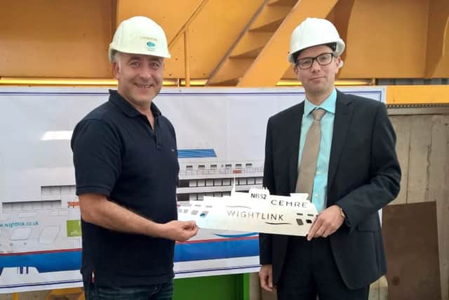 Cemre chairman Orhan Gulcek hands a souvenir of the steel cutting ceremony to Wightlink operations director Elwyn Dop