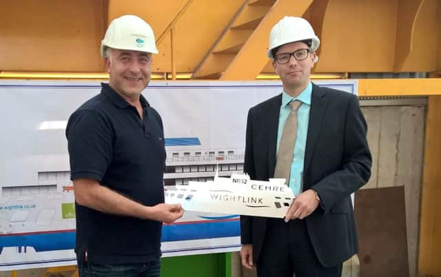 Cemre chairman Orhan Gulcek hands a souvenir of the steel cutting ceremony to Wightlink operations director Elwyn Dop