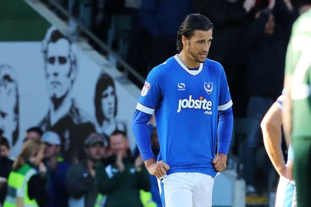 Christian Burgess cuts a dejected figure at the full-time whistle in today's 2-2 draw at Plymouth      Picture: Joe Pepler