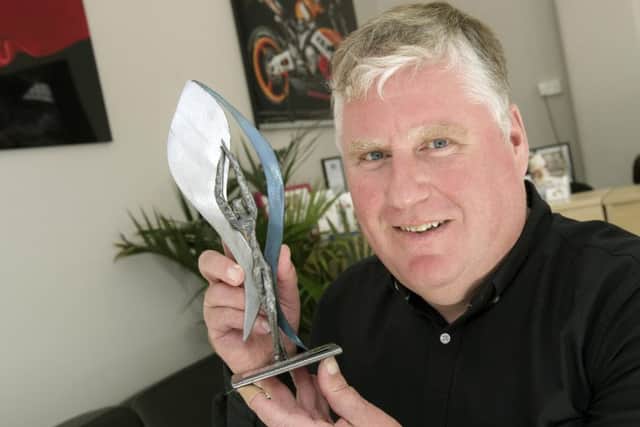 Blitz Photography owner Steve Reid with his Lifestyle and Location Award from the Master Photographers Association 2016