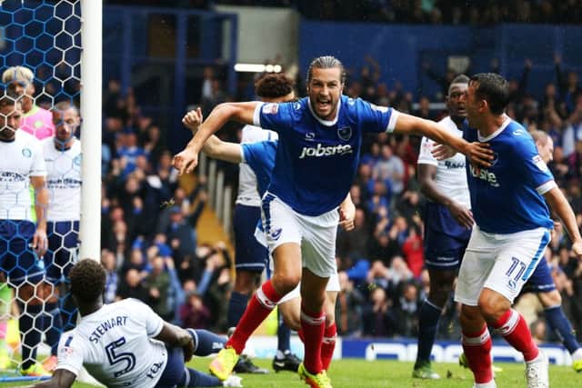 Christian Burgess celebrates scoring in the 4-2 win against Wycombe at Fratton Park in September. Picture: Joe Pepler