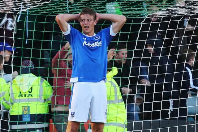 Tom Baker holds his head in his hands after Plymouth's later leveller Picture: Joe Pepler