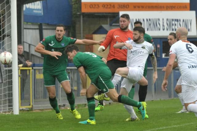 Ryan Woodford, centre, scored for the Hawks but was unable to prevent the hosts slipping to a shock 2-1 defeat to Met Police Picture: Mick Young