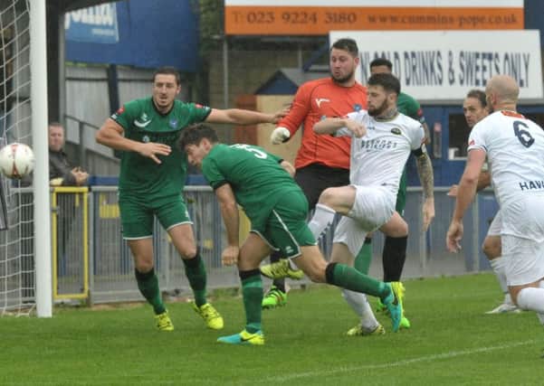 Ryan Woodford, centre, scored for the Hawks but was unable to prevent the hosts slipping to a shock 2-1 defeat to Met Police   Picture: Mick Young