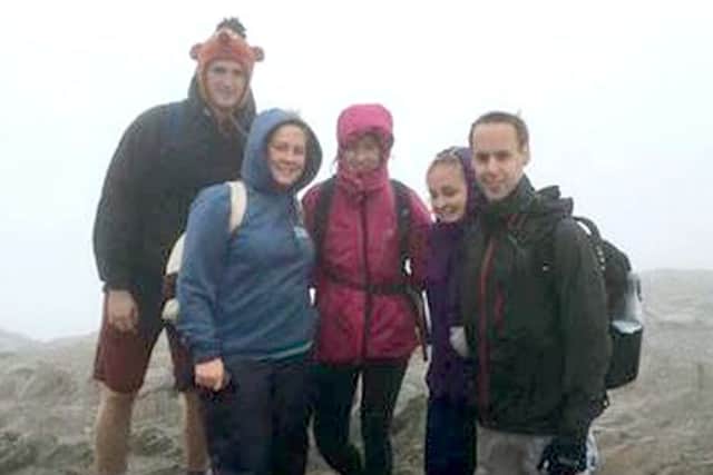 Emma Cozzi, second left, at the summit of Mount Snowdon during her fundraising feat with friends Harry Lines, Connie Wilber, Zowie Sellen and James Roberston