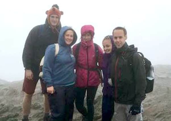 Emma Cozzi, second left, at the summit of Mount Snowdon during her fundraising feat with friends Harry Lines, Connie Wilber, Zowie Sellen and James Roberston