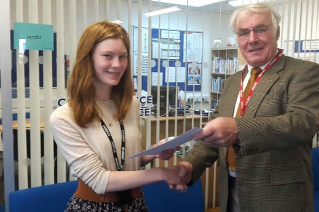 Vice president Raymond Drake presenting Courtney Davidson with her certificate
