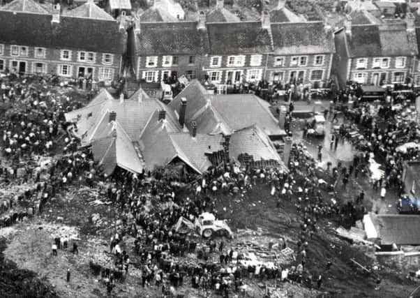The Aberfan disaster in October 1966 when a slag tip slipped and killed 116 children and 28 adults.
The roof of Pantglas Junior School stands like an island in a sea of mud and debris