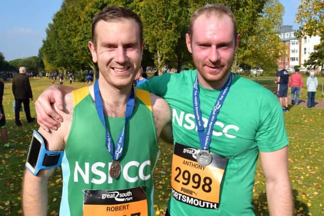 Brothers Rob Dunne (left) and Anthony Dunne after crossing the line together
