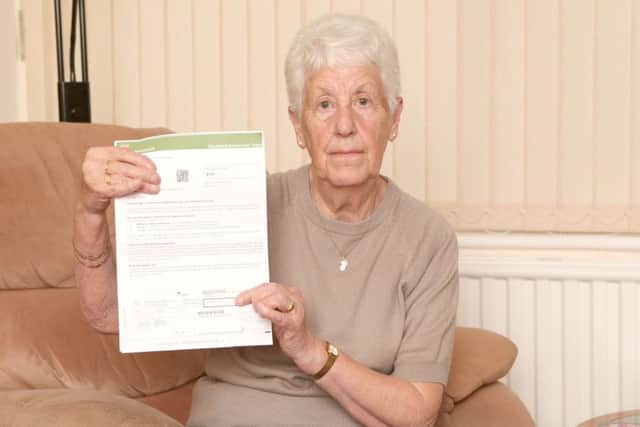 Beryl Scott with her bill from ScottishPower Picture: Habibur Rahman (161459-26)