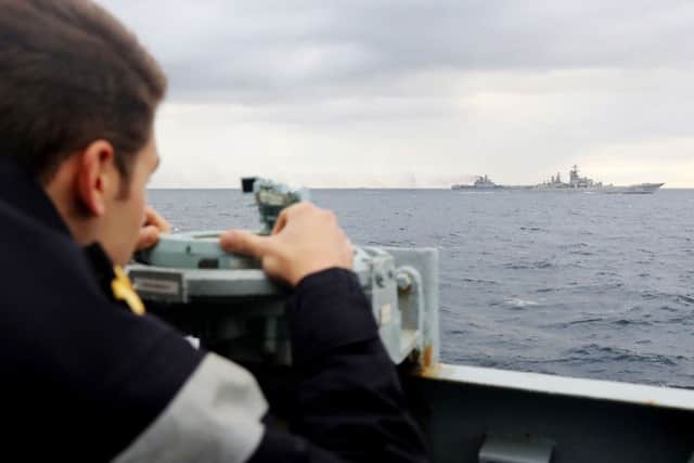 A Royal Navy lookout onboard HMS Richmond, observing a Russian task group in the North Sea