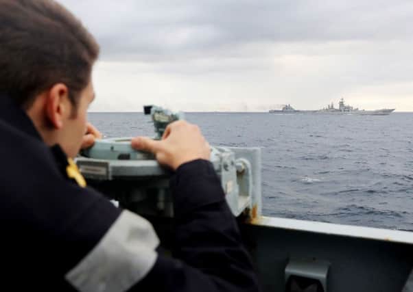 A Royal Navy lookout onboard HMS Richmond,  observing a Russian task group in the North Sea