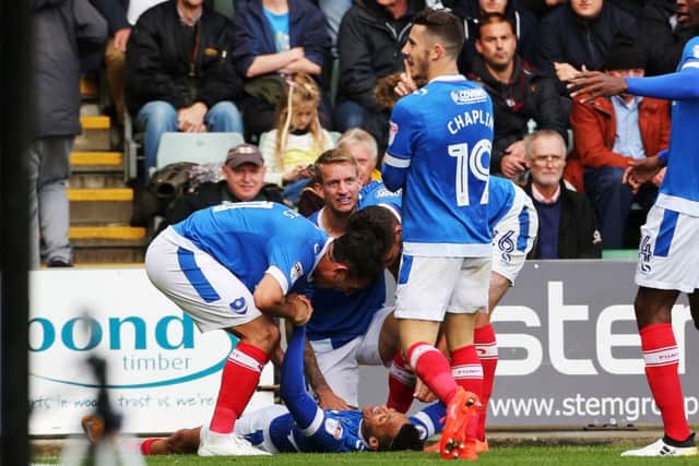 Kyle Bennett is mobbed by his team-mates after his goal against Plymouth last Saturday Picture: Joe Pepler