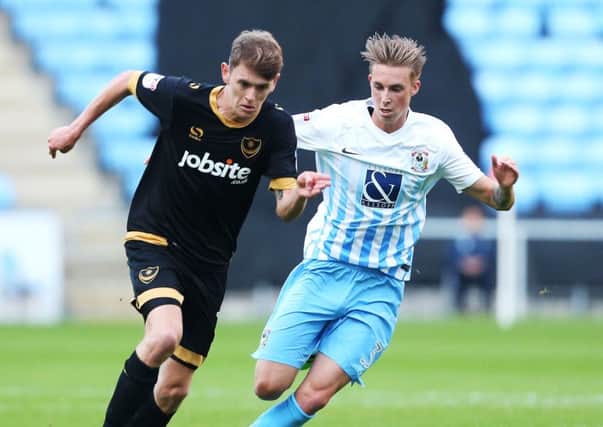 Pompey winger Ben Tollitt, left Picture: Joe Pepler