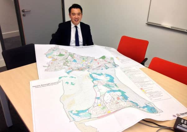 Alan Mak MP with a map of the Local Plan