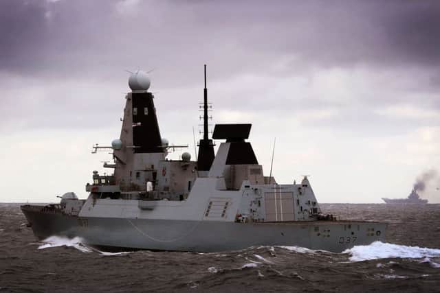 Handout photo issued by the Mininstry of Defence of HMS Duncan (centre), observing Russian Kirov Class Battlecruiser (left) and Russian aircraft carrier Admiral Kuznetsov, which are part of a Russian task group, during transit through the North Sea. PRESS ASSOCIATION Photo. Picture date: Thursday October 20, 2016. PPP-161021-083510001
