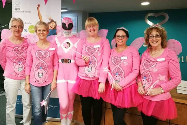 Outpatients reception girls at Spire Portsmouth Hospital in Havant, from left, Pauline Hobbs, Debs Bacon, Sarah King as a Pink Power Ranger, Melissa Perris, Kerry Murch, Hazel Gilbert