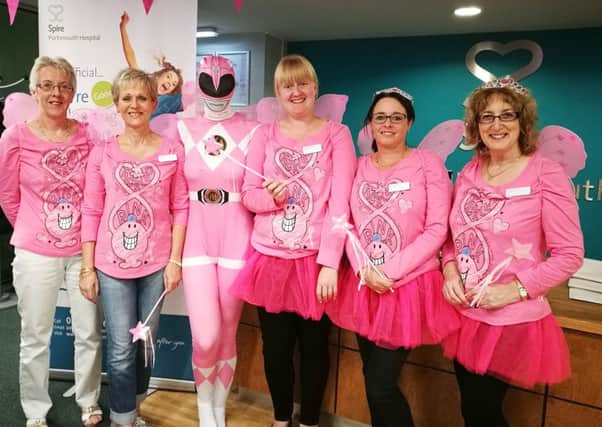 Outpatients reception girls at Spire Portsmouth Hospital in Havant, from left,
 
Pauline Hobbs, Debs Bacon, Sarah King as a Pink Power Ranger, Melissa Perris, Kerry Murch, Hazel Gilbert