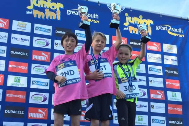Boys' winners of the Mini Great South Run. Pictured is Ruari Watts, eight, in second, Jack Portter, eight, in first, and Eddie Wilby-Lopez, eight, right.