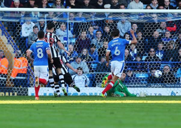 Adam Campbell scores Notts County's second goal against Pompey Picture: Joe Pepler