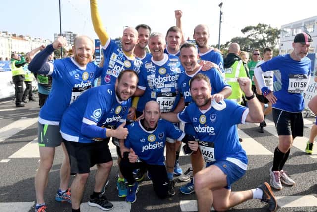 Touchline Tony, centre, behind kneeling man, with Pompey runners Picture: Paul Jacobs (160271-25)