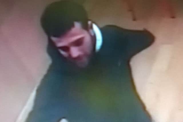 CCTV of a man Hampshire Police want to speak to in connection with a burglary in the Albert Food Store