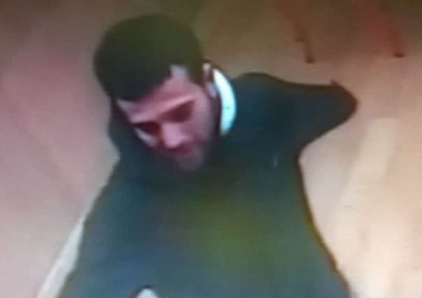CCTV of a man Hampshire Police want to speak to in connection with a burglary in the Albert Food Store