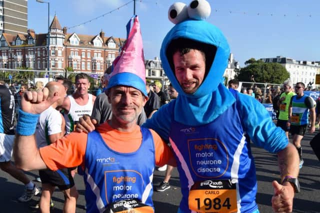 Carlo van Leeuwen, right, finished the Great South Tun in 1 hour, 9 minutes, dressed as The Cookie Monster