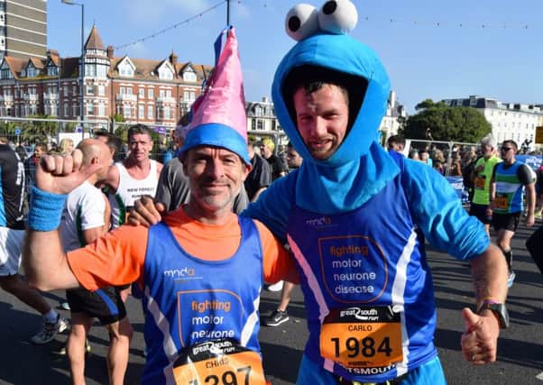 Carlo van Leeuwen, right, finished the Great South Tun in 1 hour, 9 minutes, dressed as The Cookie Monster