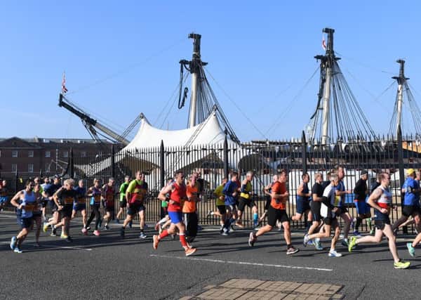 Passing HMS Victory during the 10-mile run 
Picture: Paul Jacobs/pictureexclusive.com