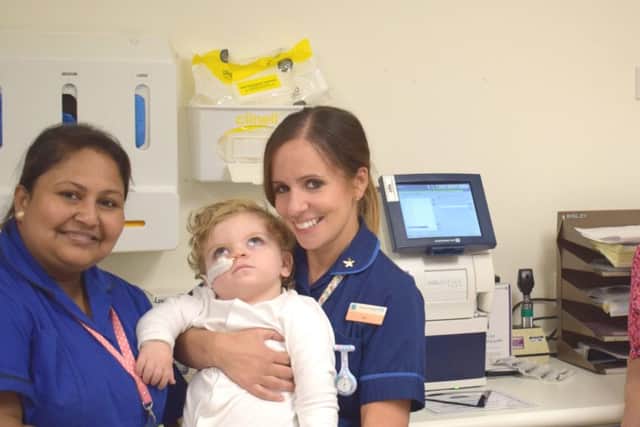 Nurses Binata Ghosh and Jess Dodgson with patient Noah Yaxley