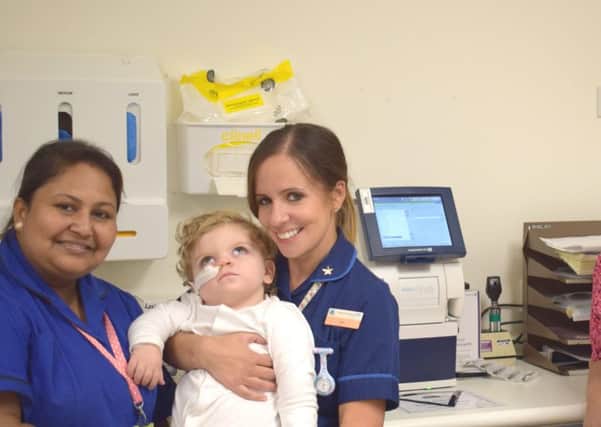 Nurses Binata Ghosh and Jess Dodgson with patient Noah Yaxley