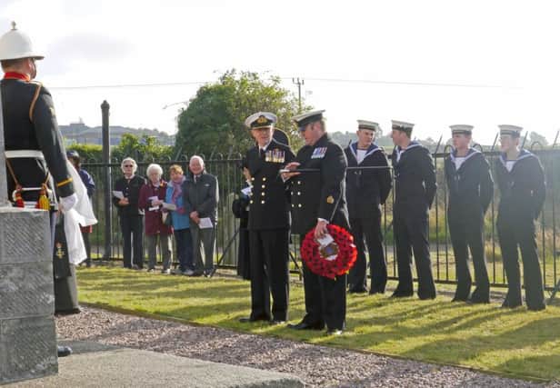 Naval officers and ratings, a Royal Marines bugler and civilians at the Nelson Monument last Friday celebrate the life of our national hero on Trafalgar Day. Picture:  Allan Smith