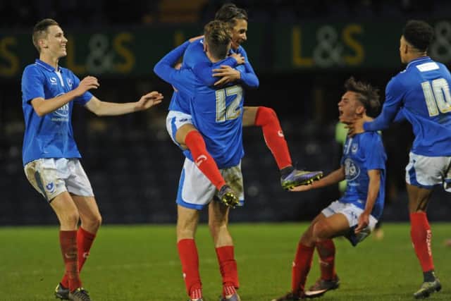 Harvey Bradley, centre, is mobbed by his Academy team-mates after his goal against Manchester City last season