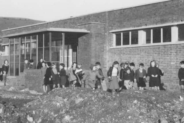 Hillside School, Paulsgrove, with young pupils playing amid the builders' rubble. (Barry Cox collection)
