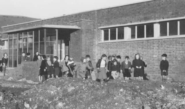 Hillside School, Paulsgrove, with young pupils playing amid the builders' rubble. (Barry Cox collection)