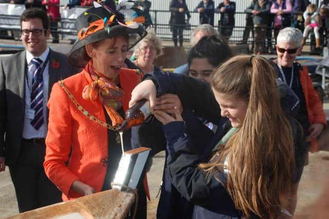 The Lady Mayoress of Portsmouth Leza Tremorin with Kacey-Ellen Thornton, 15, and Maryam Cheema, 14, of the Portsmouth Sail Training Trust, which helped build Little Warrior, for the first  anniversary of International Boatbuilding Technical College Portsmouth