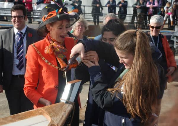 The Lady Mayoress of Portsmouth Leza Tremorin with Kacey-Ellen Thornton, 15, and Maryam Cheema, 14, of the Portsmouth Sail Training Trust, which helped build Little Warrior, for the first  anniversary of International Boatbuilding Technical College Portsmouth