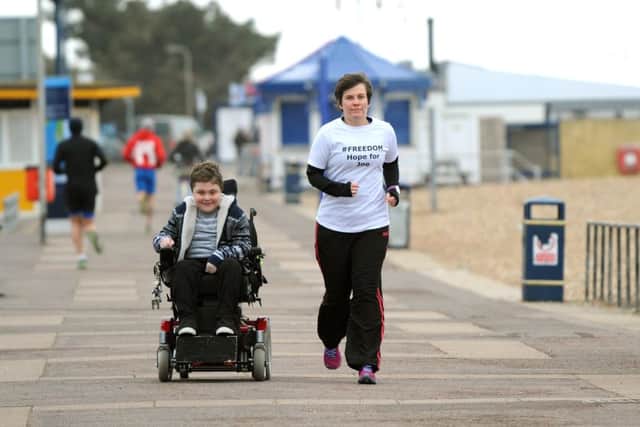Joe Rush, 14, with Janet Dickso, who is running hundreds of miles to fundraise for him